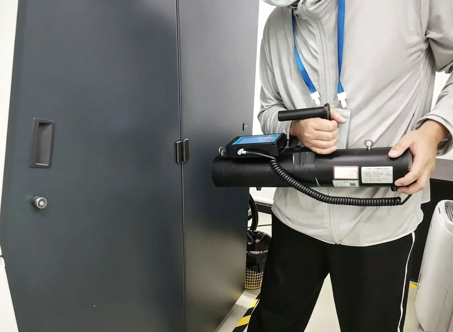 Radiation leakage detection test on lead-lined industrial CT shielding cabinet door