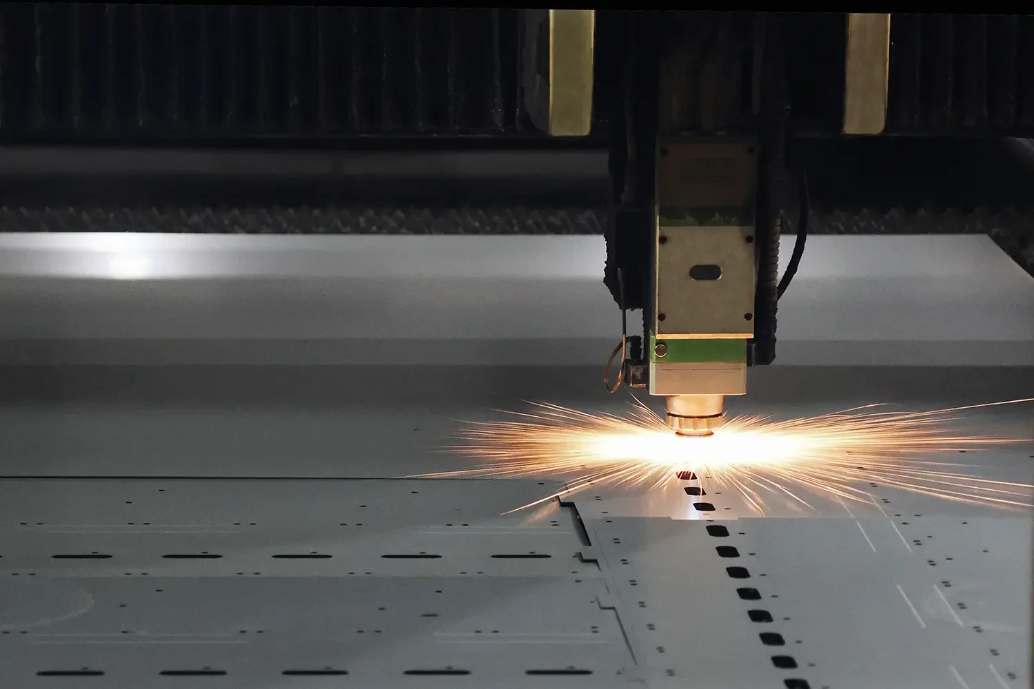 Fiber laser cutting machine processing steel sheet for custom EV charger enclosure fabrication