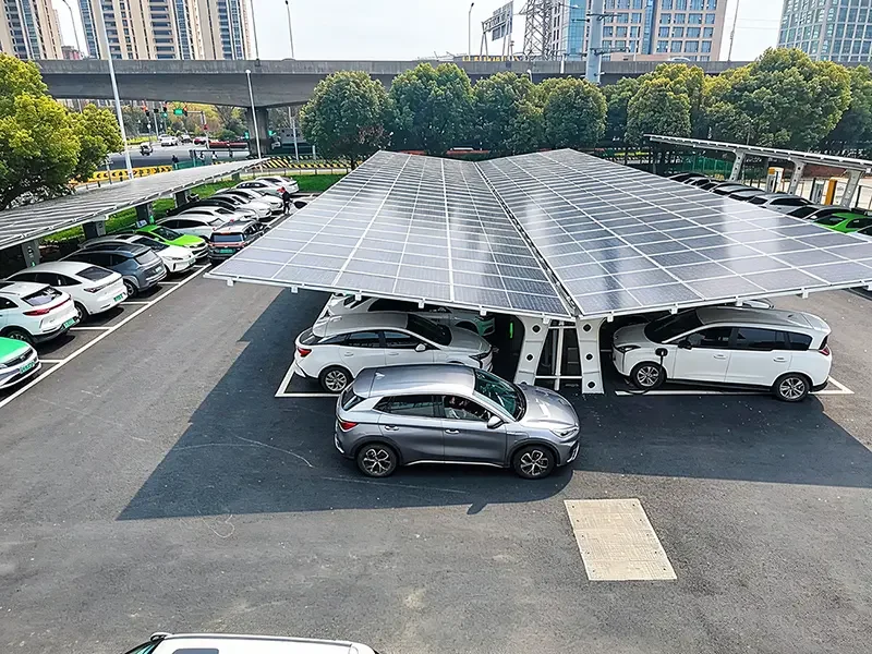 Outdoor solar carport EV charging station with multiple electric vehicles parked in a public parking lot